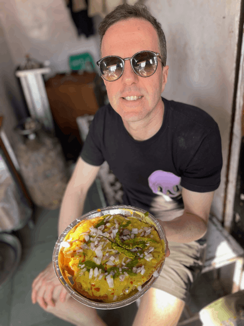 Paul Tomlinson eating in India